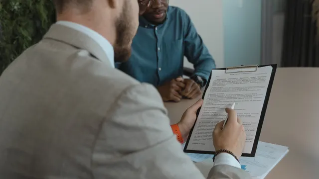 Recruiter carefully reviewing a candidate's submitted documents