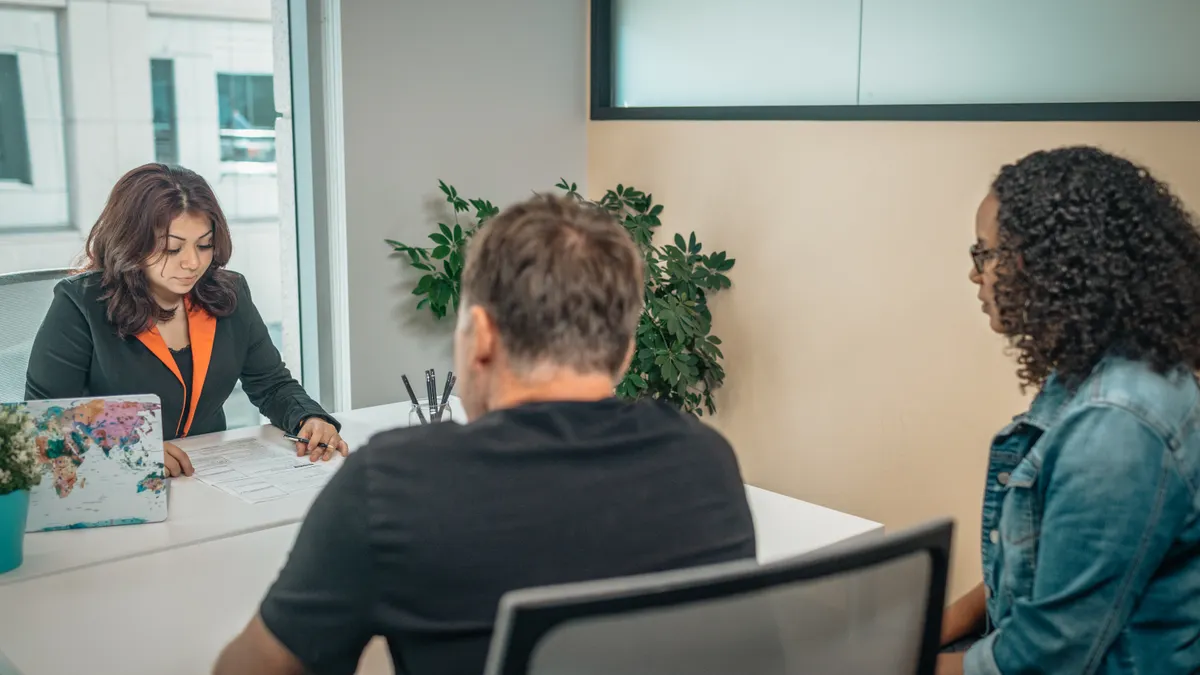 HR consultant meeting with employees in a private office