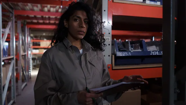 Warehouse professional checking stock with a clipboard