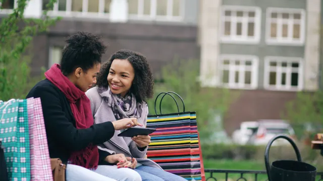 Shoppers discussing their retail experience after a purchase