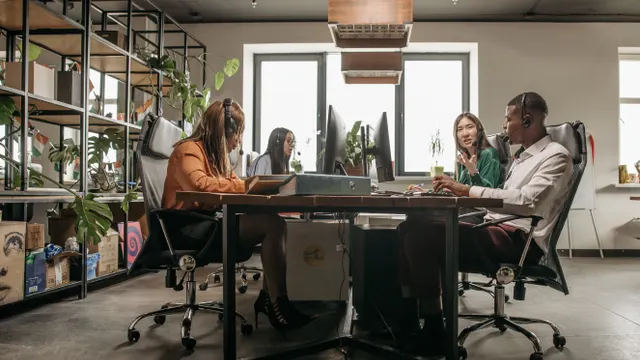 Customer support team collaborating in a modern contact centre