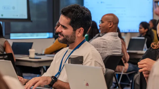 Professionals building sales capability during a training workshop