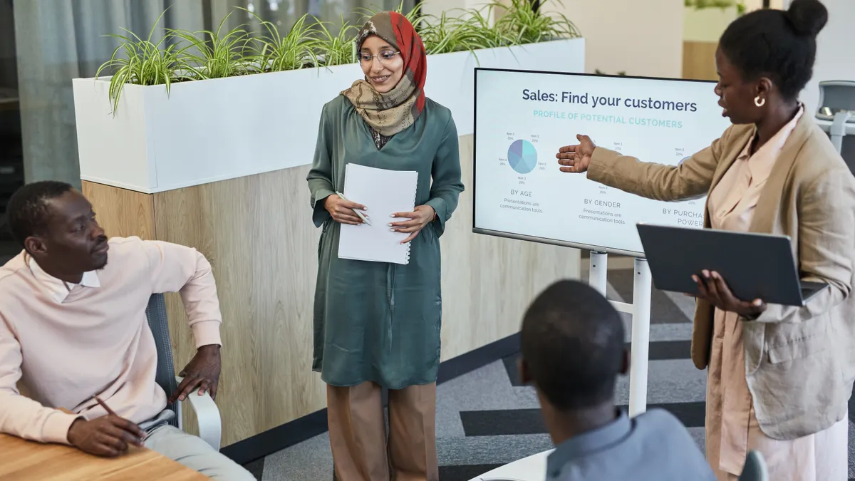 Sales professionals presenting a customer acquisition strategy